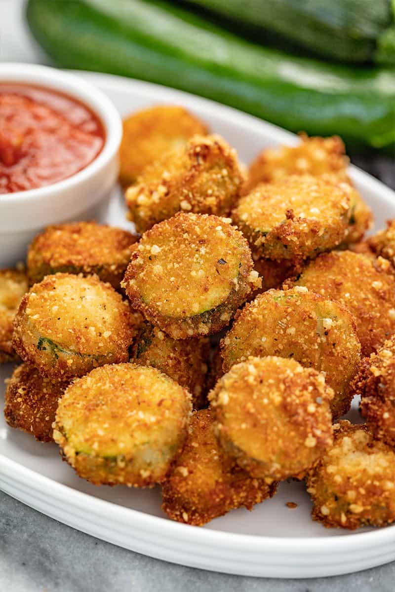 Close up of Parmesan Fried Zucchini on a serving plater.