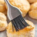 Butter brushed onto a freshly baked biscuit