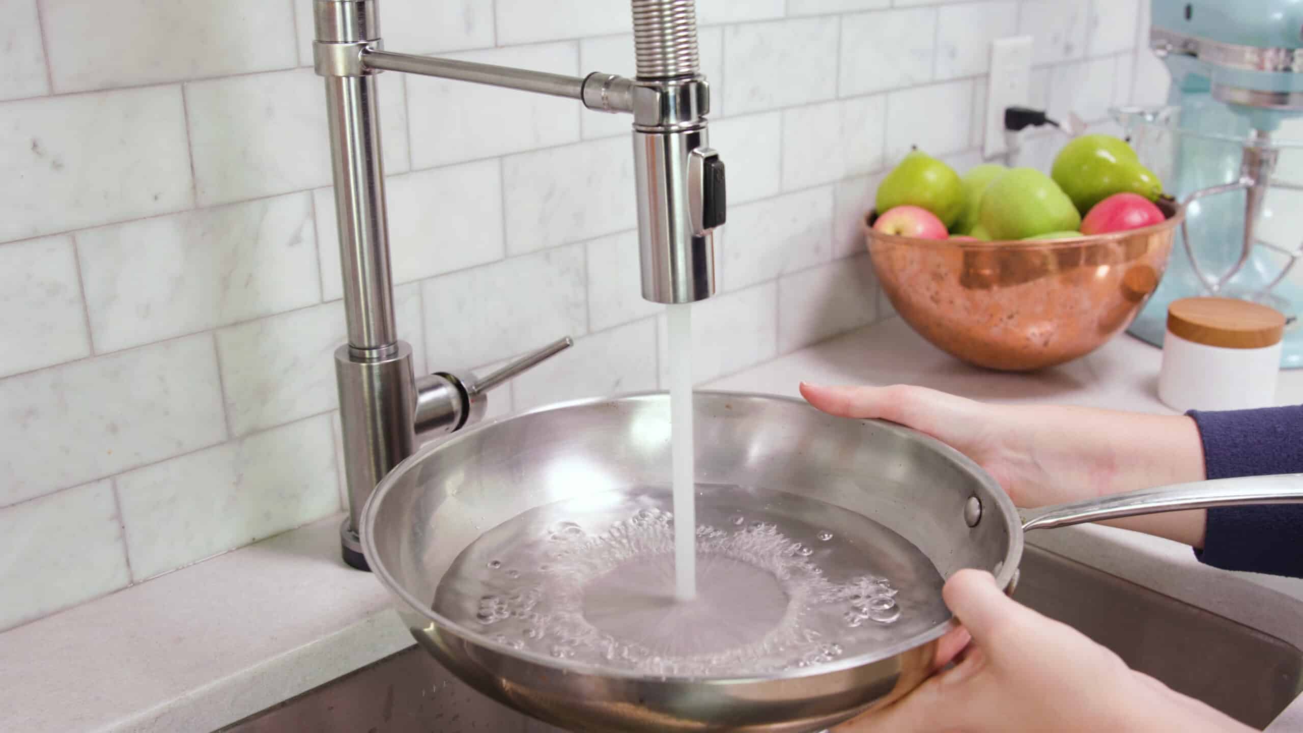 Fill a silver saucepan about half way full with water from faucet.