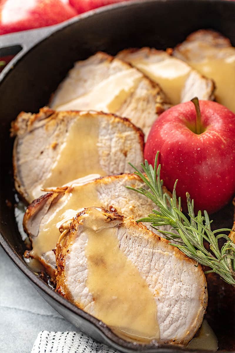 Pork Loin Roast with Apple Glaze in a cast-iron skillet.