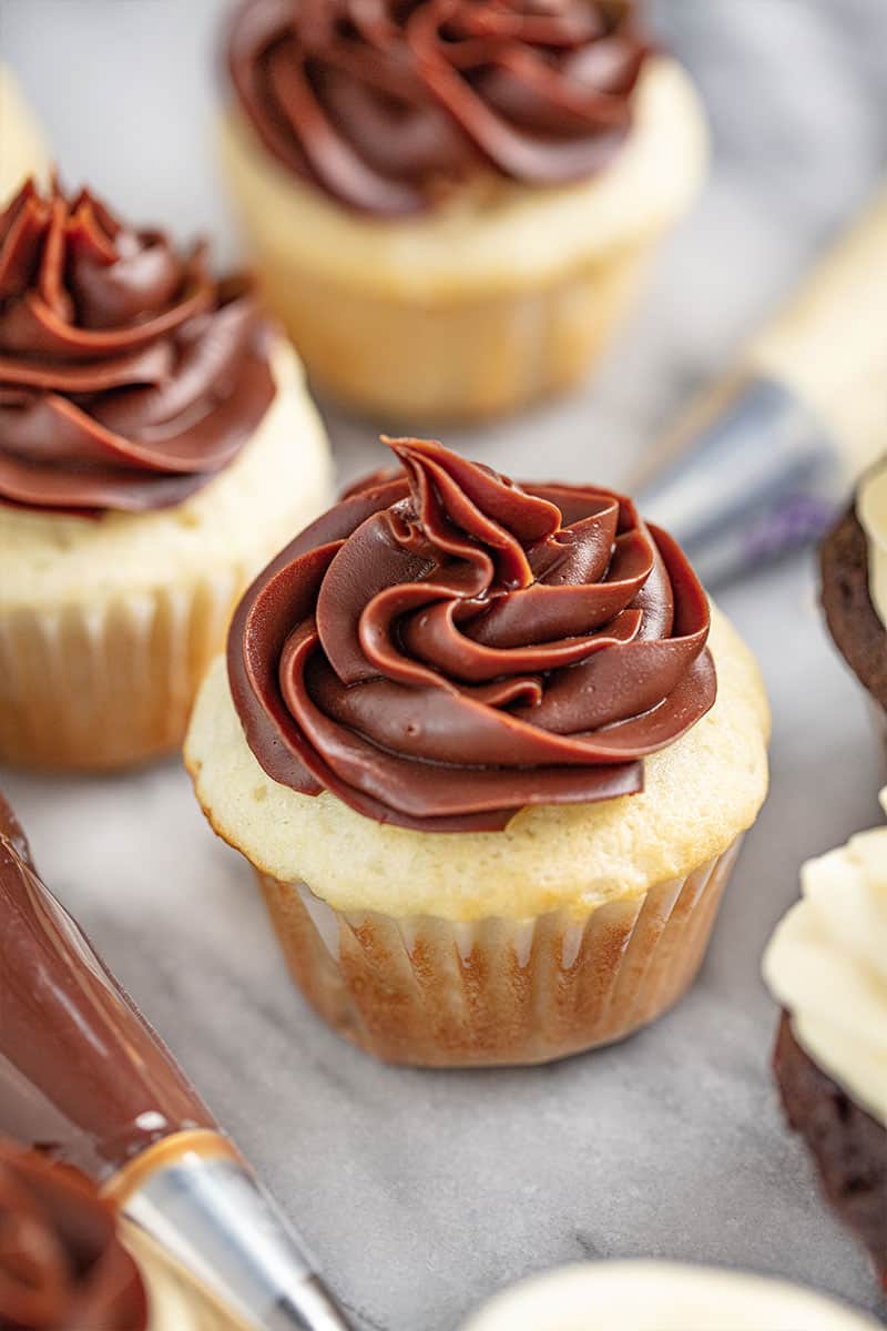 Chocolate Sweetened Condensed Milk Frosting on a white cupcake.