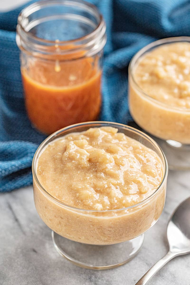 a glass cup filled with salted caramel rice pudding.