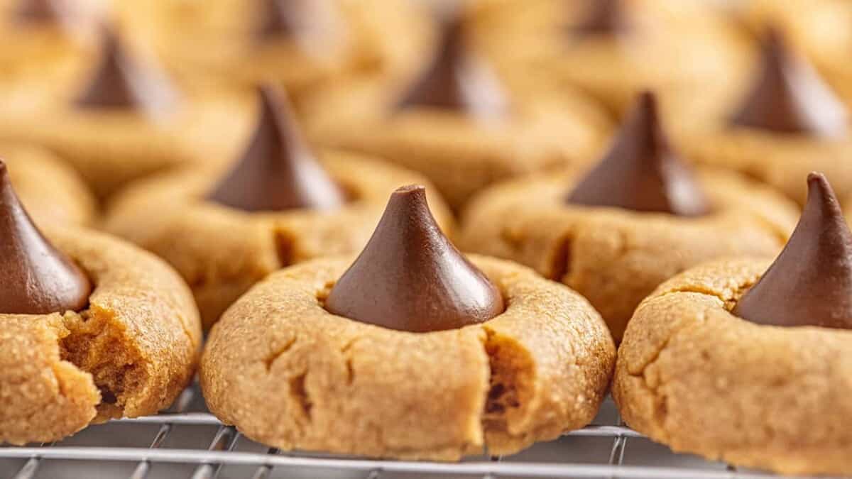 Close up of Peanut Butter Kiss Cookies on a wire cooling rack.