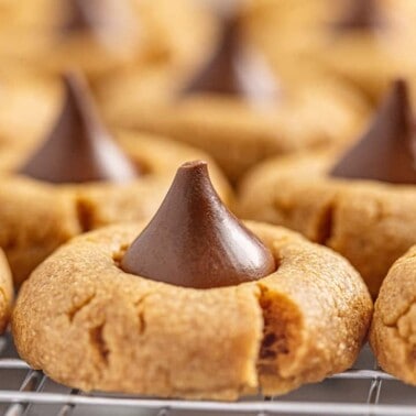 Close up of Peanut Butter Kiss Cookies on a wire cooling rack.