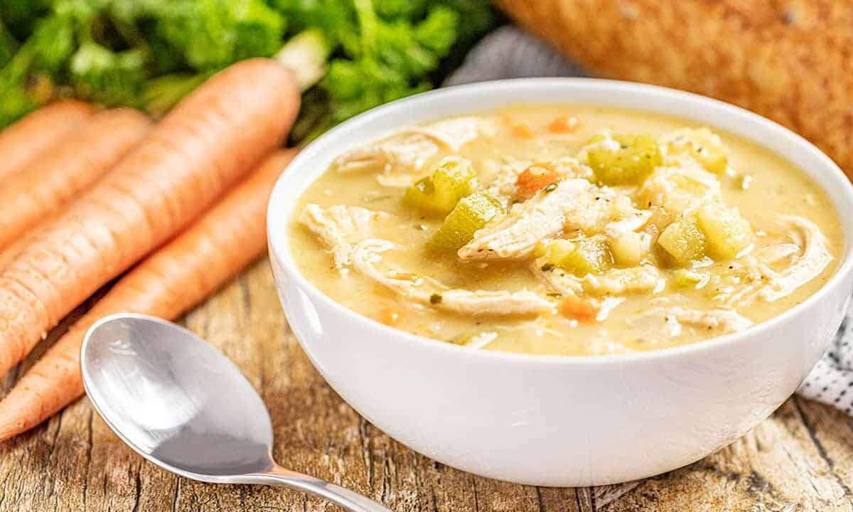 Slow cooker turkey soup in a white bowl