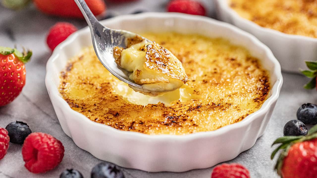 Creme Brulee in ramekin with spoonful taken out