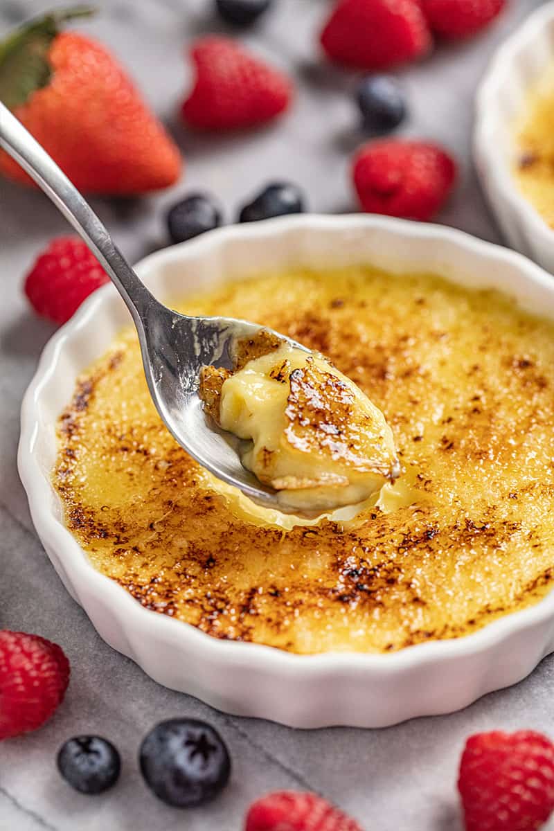 Creme Brulee in ramekin with spoonful taken out