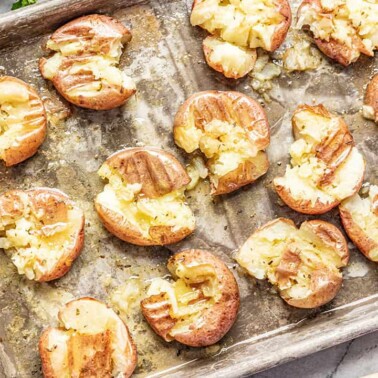 Honey roasted smashed potatoes on sheet pan