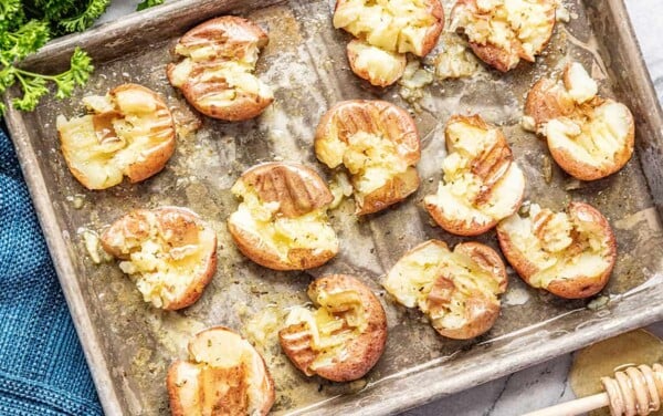 Honey roasted smashed potatoes on sheet pan