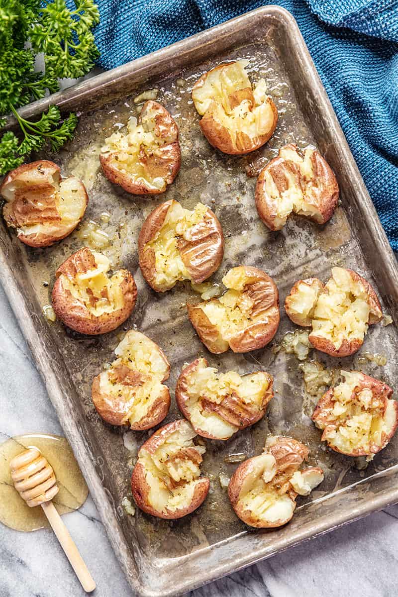 Honey roasted smashed potatoes on sheet pan