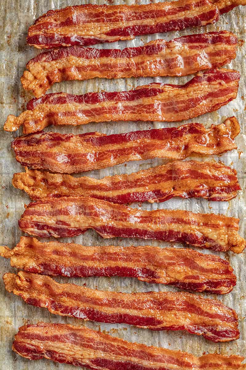 Oven cooked bacon on parchment paper