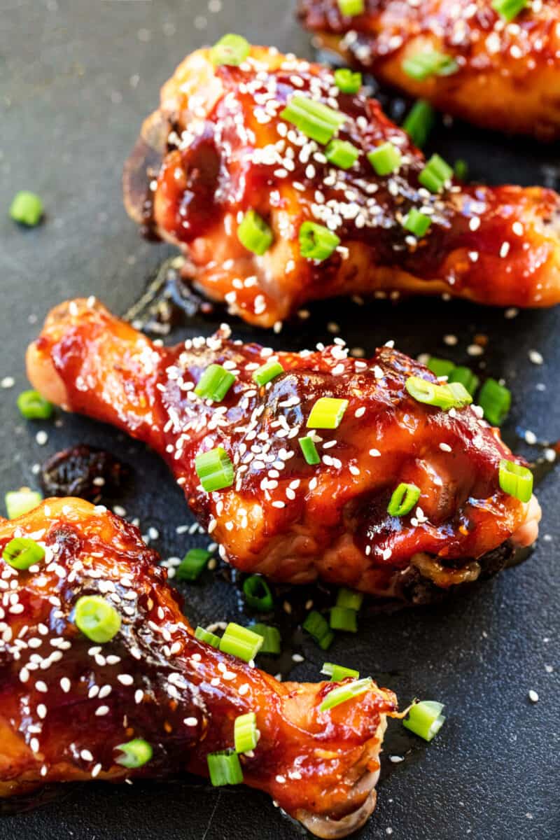 Korean Glazed Chicken Drumsticks on  a black counter top.