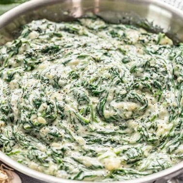 Creamed spinach in a stainless steel skillet