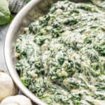 Creamed spinach in a stainless steel skillet