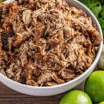 Crockpot carnitas in a white bowl