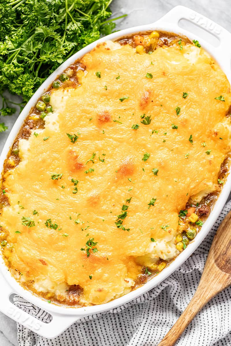 Old Fashioned Shepherd's Pie in a casserole dish sprinkled with fresh chopped parsley