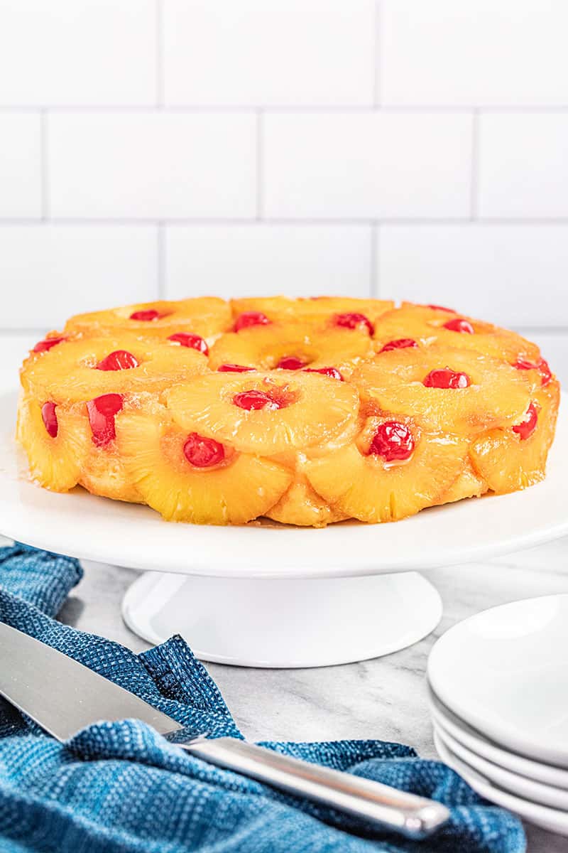 Pineapple Upside Down Cake on a white cake plate