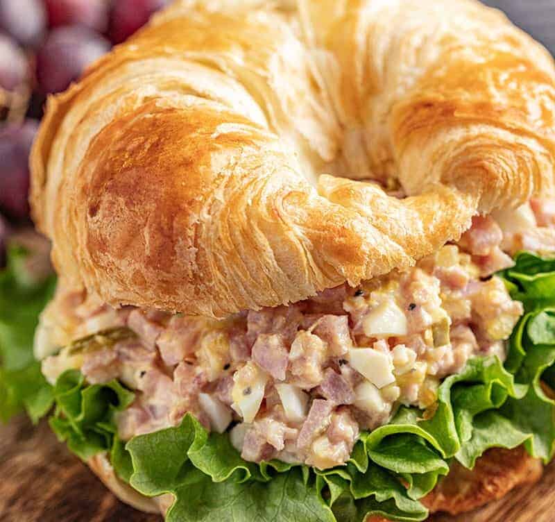 Ham salad on a flaky croissant with romaine lettuce
