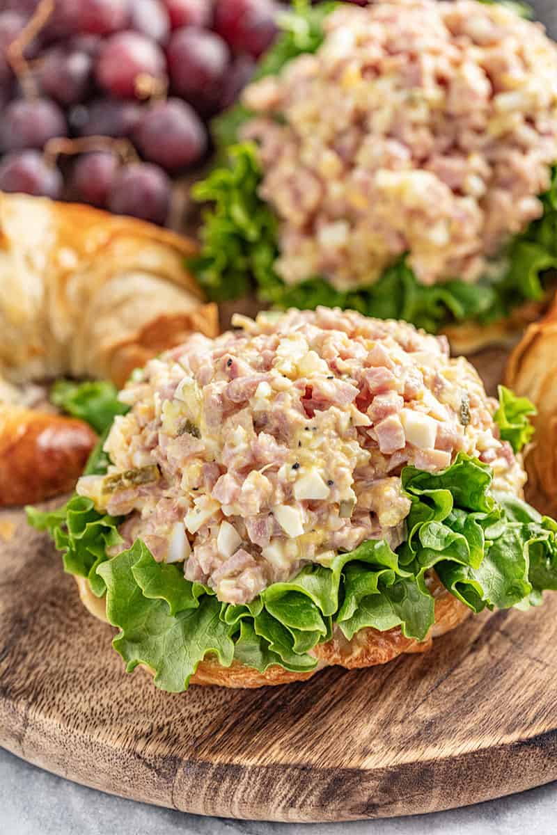 Ham salad on a bed of lettuce on a croissant half