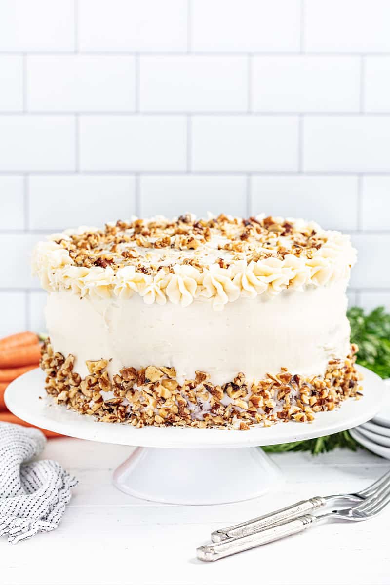 Carrot cake on a white cake platter