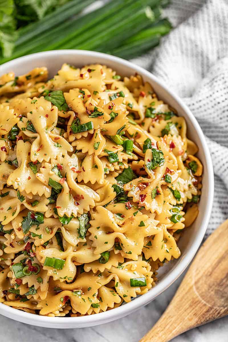 Spicy thai pasta salad topped with green onions
