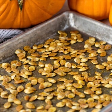 Roasted Pumpkin Seeds on a cooking sheet.