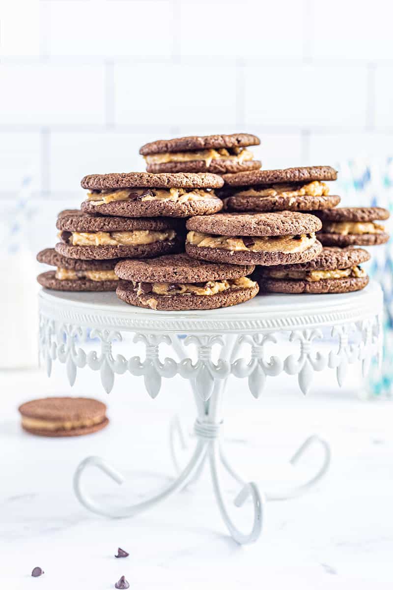 a stack of cookie dough Oreo cookies on a serving platter