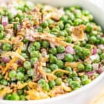 Close up view of a bowl filled with pea salad
