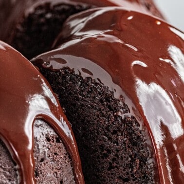 a close up view of chocolate ganache cake with ganache