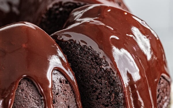 a close up view of chocolate ganache cake with ganache