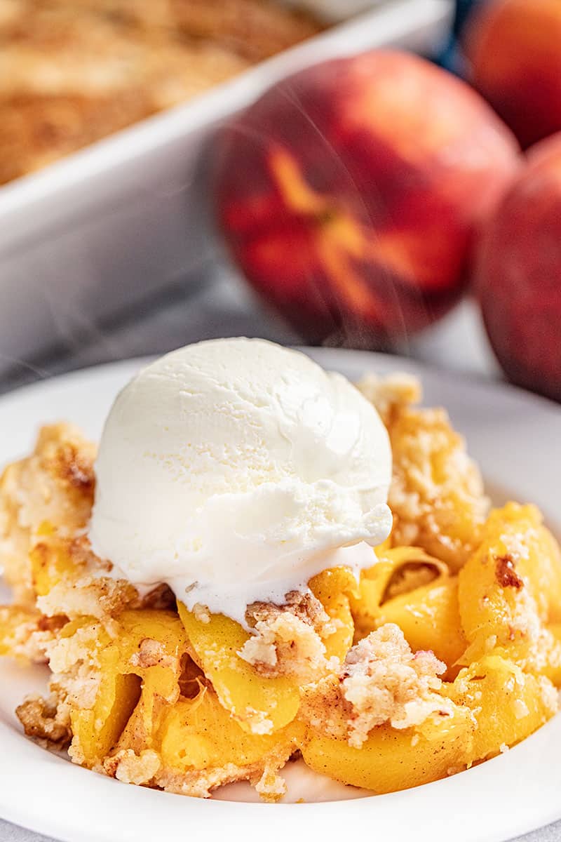 Peach Dump Cake is a family favorite summertime dessert made entirely from scratch with just a handful of simple ingredients. The recipe includes instructions for frozen, fresh, or canned peaches. No box cake mix needed! 