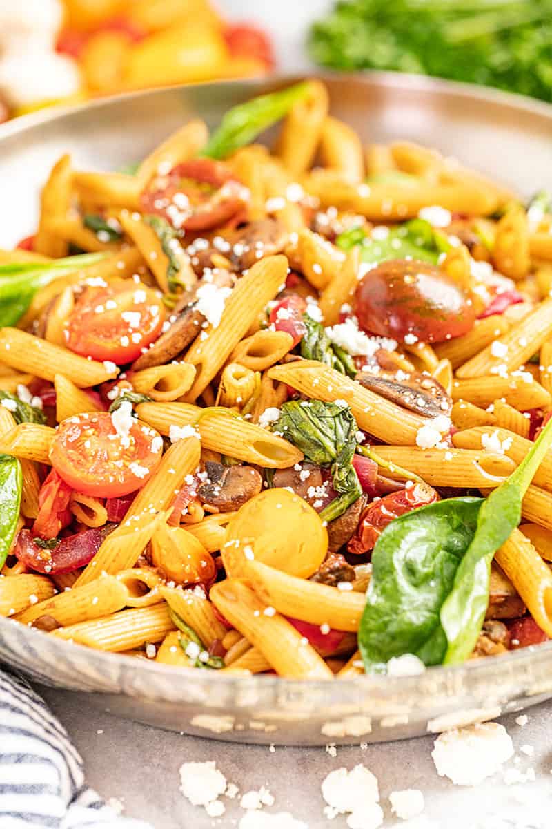 penne pasta with veggies in a large skillet