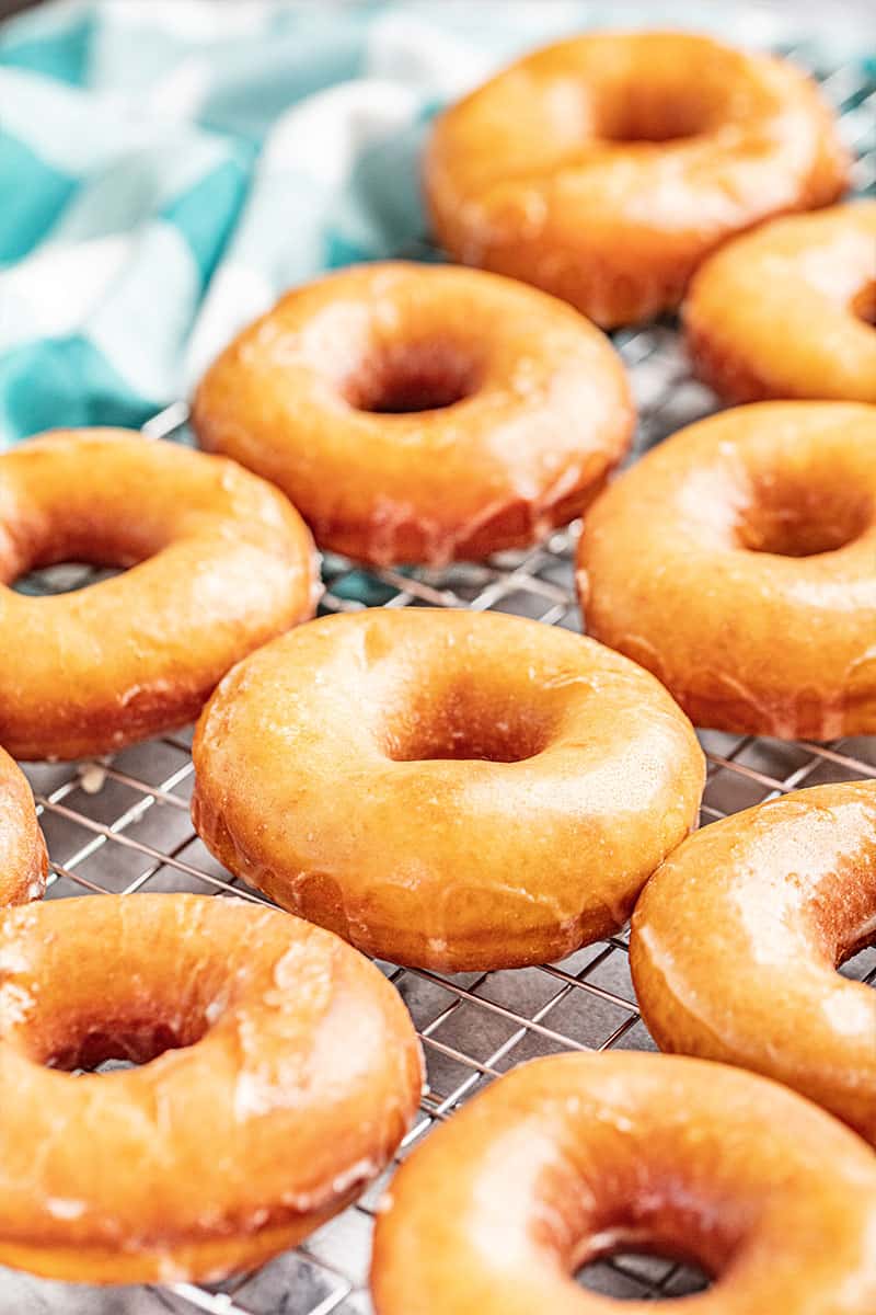 Glazed donuts on a cooling rack