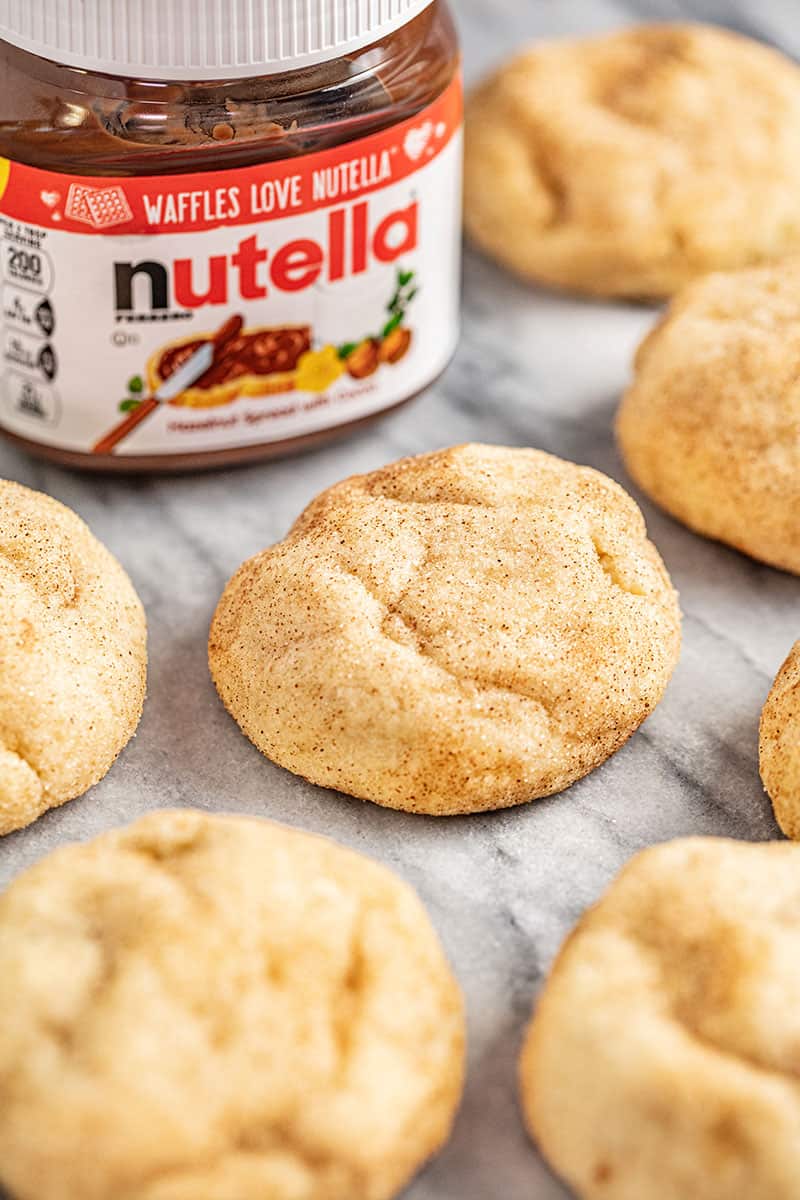 a batch of churro cookies stuffed with chocolate