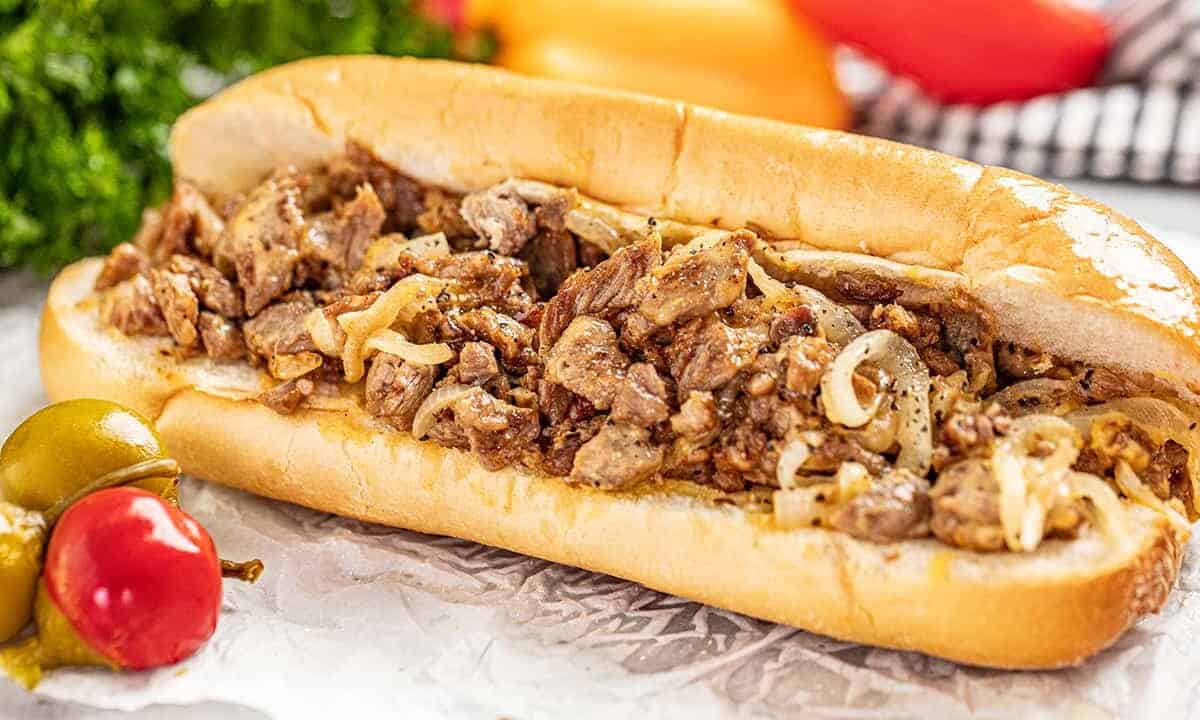 authentic Philly cheesesteak on a homemade hoagie roll