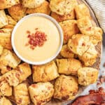 a tray filled with bacon and cheddar pretzel bites.