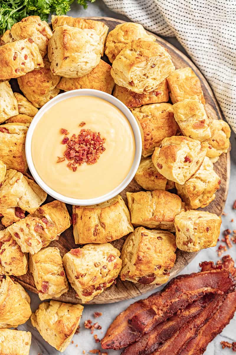 a tray filled with bacon and cheddar pretzel bites.