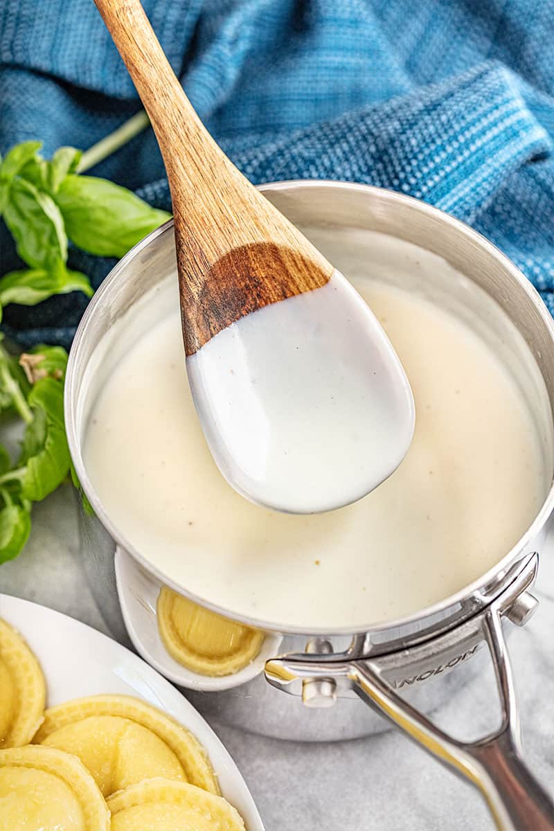 a saucepan filled with béchamel sauce.