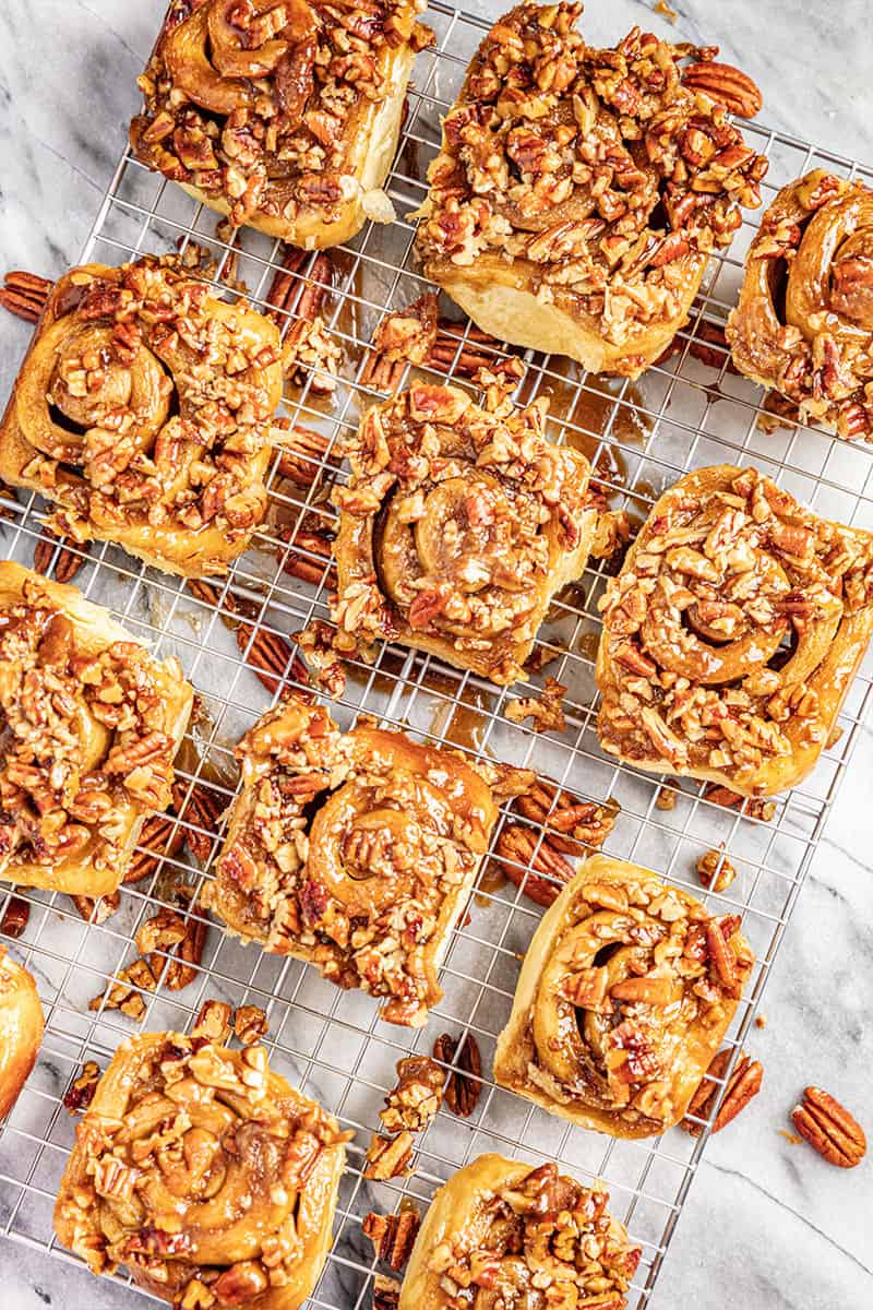 maple pecan sticky buns on a wire rack.