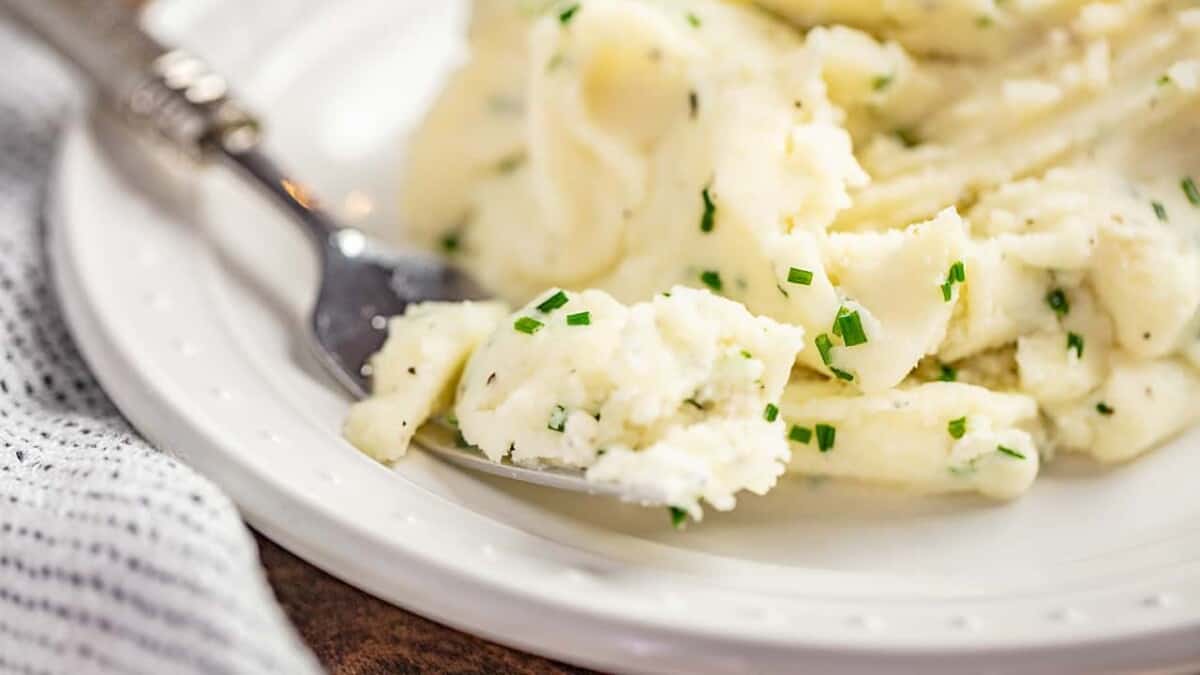 A forkful of herbed garlic mashed potatoes.