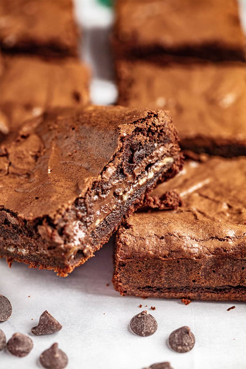 Andes mint brownies cut to show the fudgey layer in the middle.