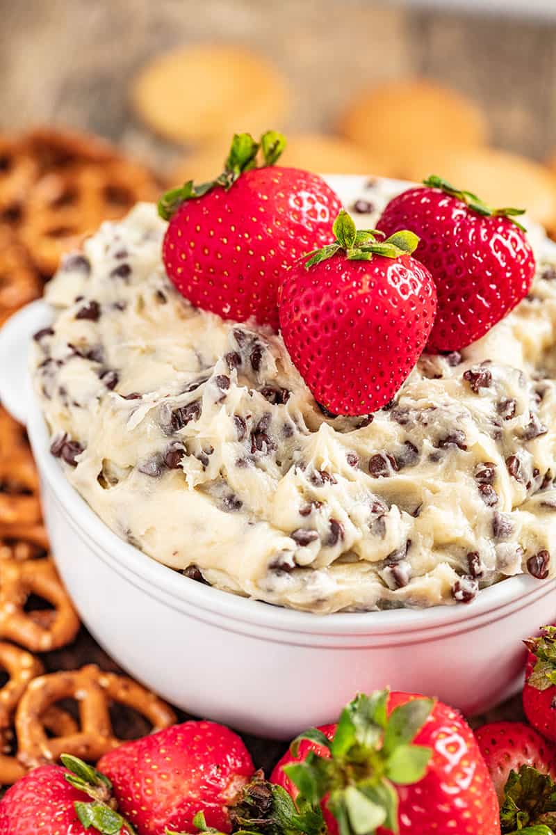 Chocolate chip cookie dough dip with strawberries on top.