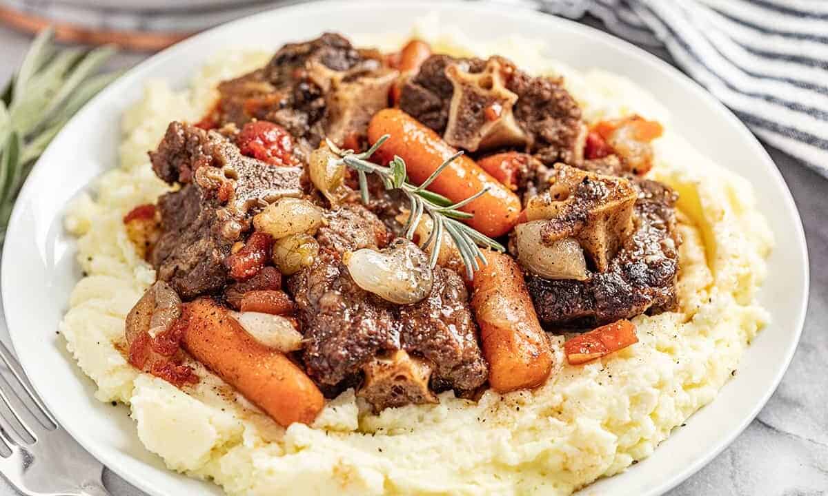Simple braised oxtails served on a bed of mashed potatoes.