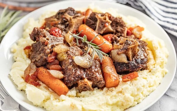 Simple braised oxtails served on a bed of mashed potatoes.
