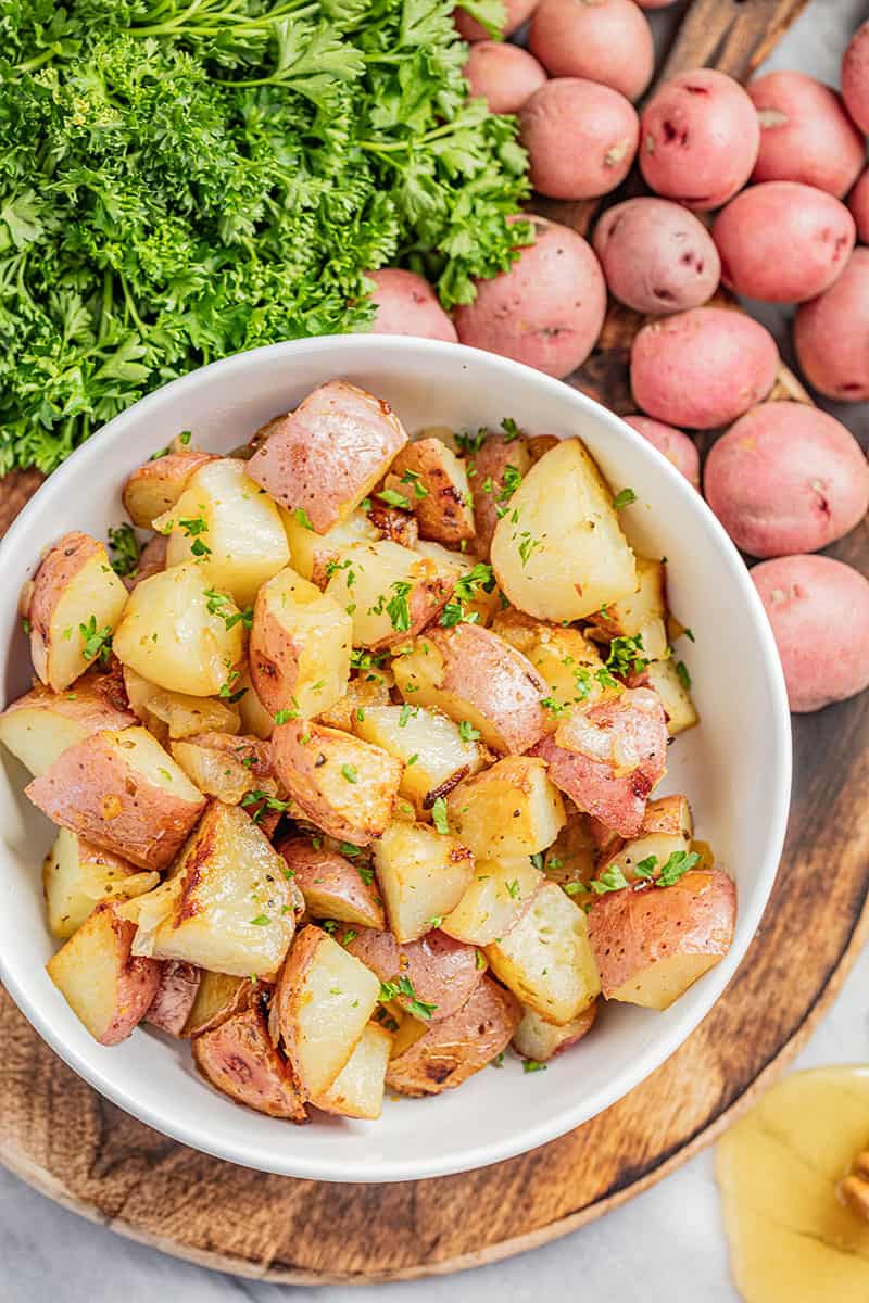 Honey roasted potatoes with freshly chopped parsley on top.