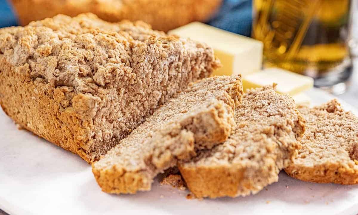 A loaf of beer bread cut into a few slices.