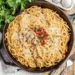 Overhead view of chicken carbonara in a skillet.