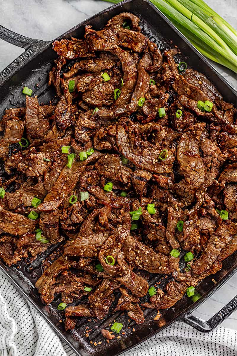 Korean Beef Bulgogi in a cast iron skillet.