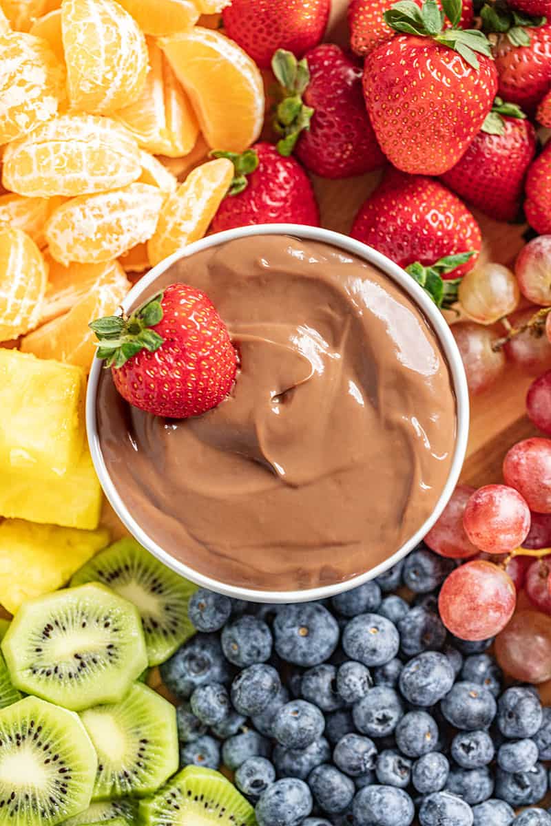 Overhead view of a ramekin filled with nutella fruit dip.