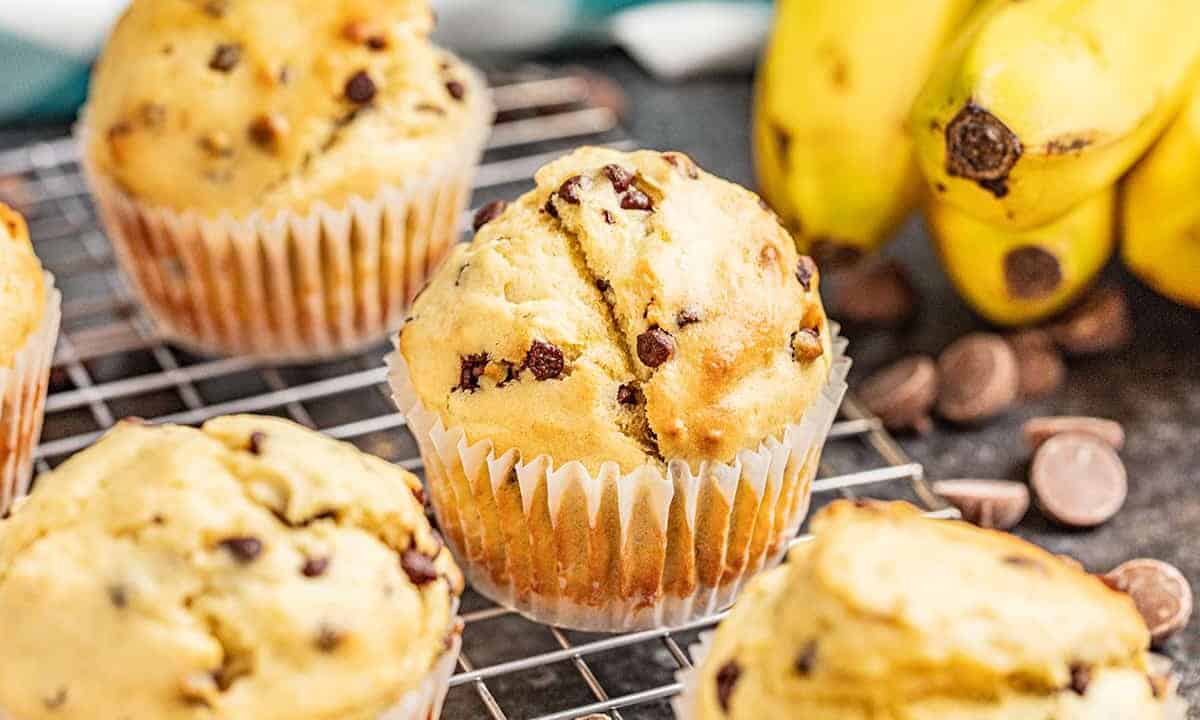 Banana chocolate chip muffins on a cooling rack.